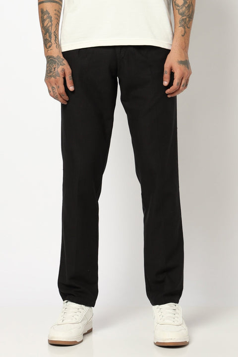 BLACK REALXED FIT TRAVELLER PANTS - Trousers - 250740725