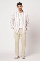 BEIGE SLIM TRAVELLER PANTS - Trousers - 251041396