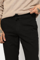 BLACK PLAIN TRAVELLER FIT COTTON TROUSER - Trousers - 250840884