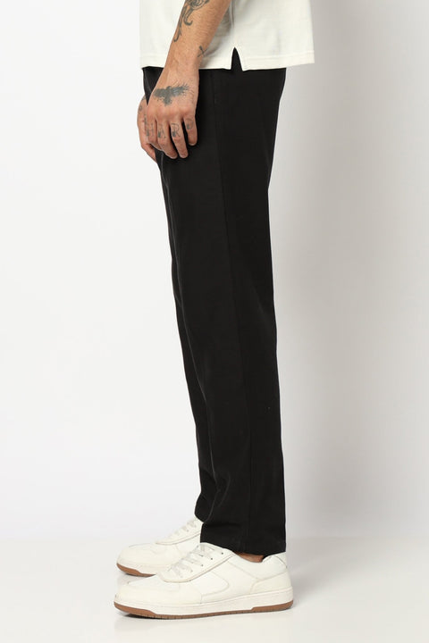 BLACK REALXED FIT TRAVELLER PANTS - Trousers - 250740725