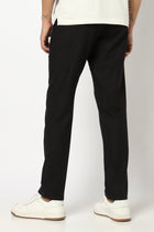 BLACK REALXED FIT TRAVELLER PANTS - Trousers - 250740725