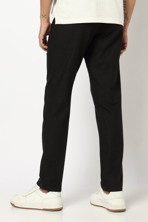 BLACK REALXED FIT TRAVELLER PANTS - Trousers - 250740725