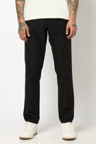 BLACK REALXED FIT TRAVELLER PANTS - Trousers - 250740725