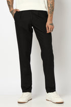 BLACK REALXED FIT TRAVELLER PANTS - Trousers - 250740725