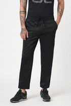 BLACK RELAXED TRAVLLER TROUSER - Trousers - 251141431