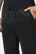 BLACK RELAXED TRAVLLER TROUSER - Trousers - 251141431