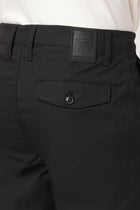 BLACK SLIM FIT TRAVELLER MEN'S PANTS - Trousers - 251041391