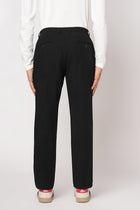BLACK SLIM FIT TRAVELLER PANTS - Trousers - 251141411