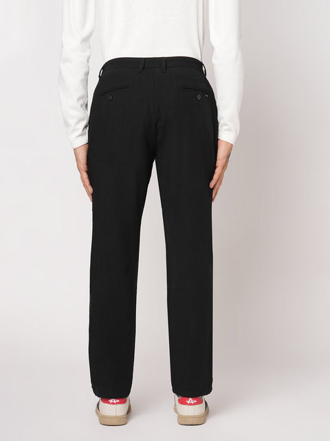 BLACK SLIM FIT TRAVELLER PANTS - Trousers - 251141411
