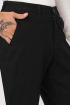 BLACK SLIM FIT TRAVELLER PANTS - Trousers - 251141411