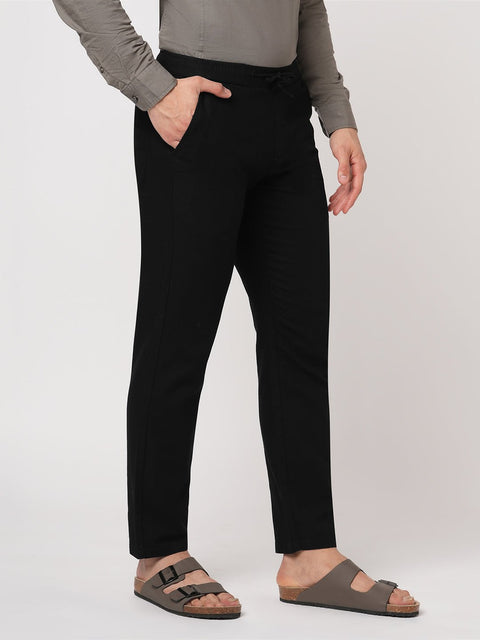 BLACK SLIM TRAVELLER PANTS - Trousers - 251241672