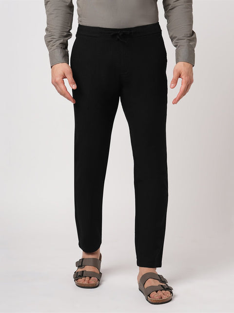 BLACK SLIM TRAVELLER PANTS - Trousers - 251241672