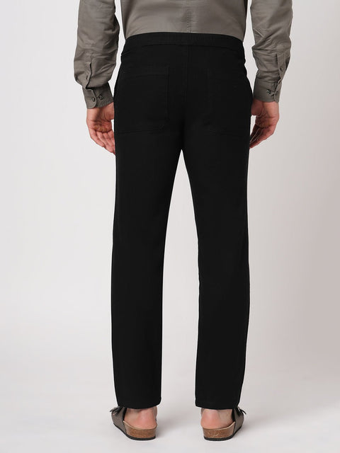 BLACK SLIM TRAVELLER PANTS - Trousers - 251241672
